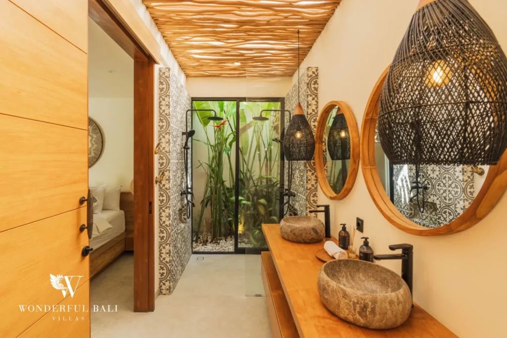 Bedroom with round mirror under a timber ceiling at villa in Seseh, Bali