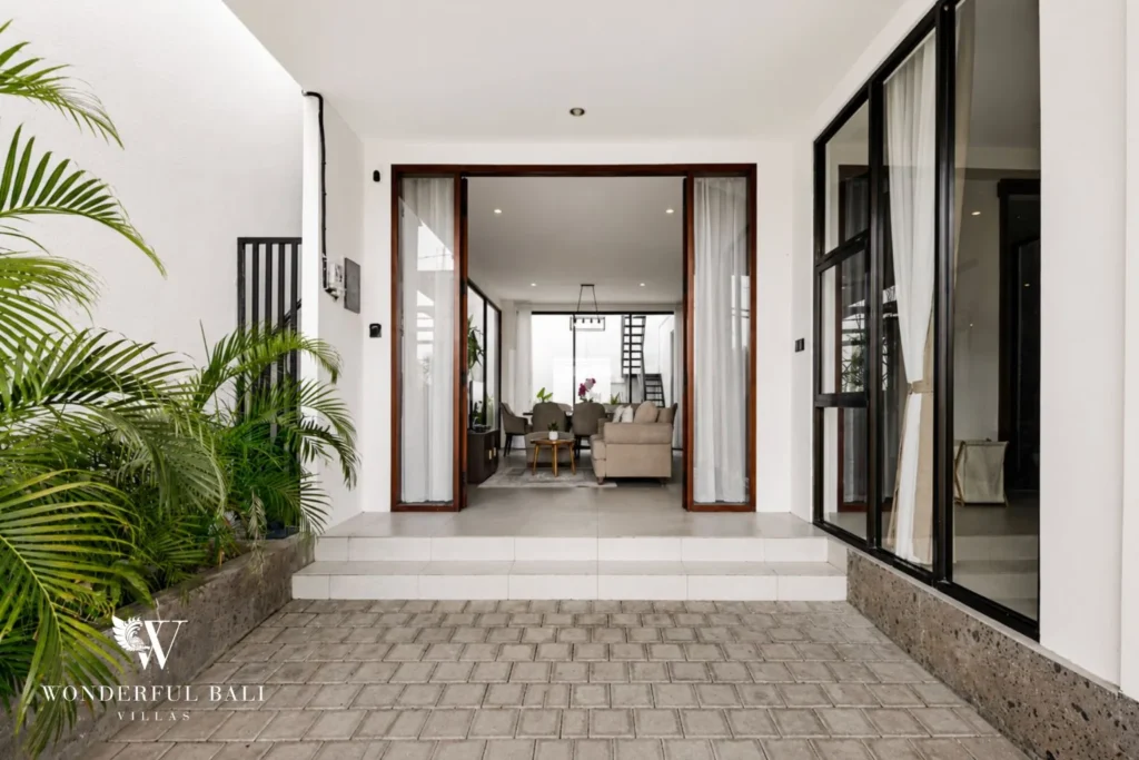 monthly villa rental pererenan — hallway with bedroom doors