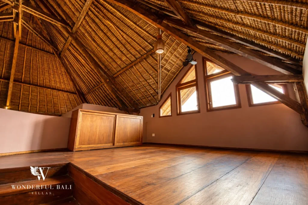 Detail of the thatched roof and timber ceiling structure at villa in Bumbak, Bali