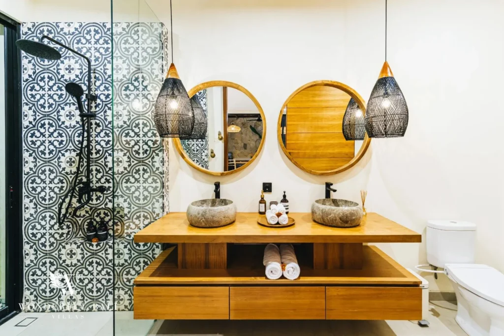 Bathroom with double vessel basins and patterned tile at villa in Seseh, Bali