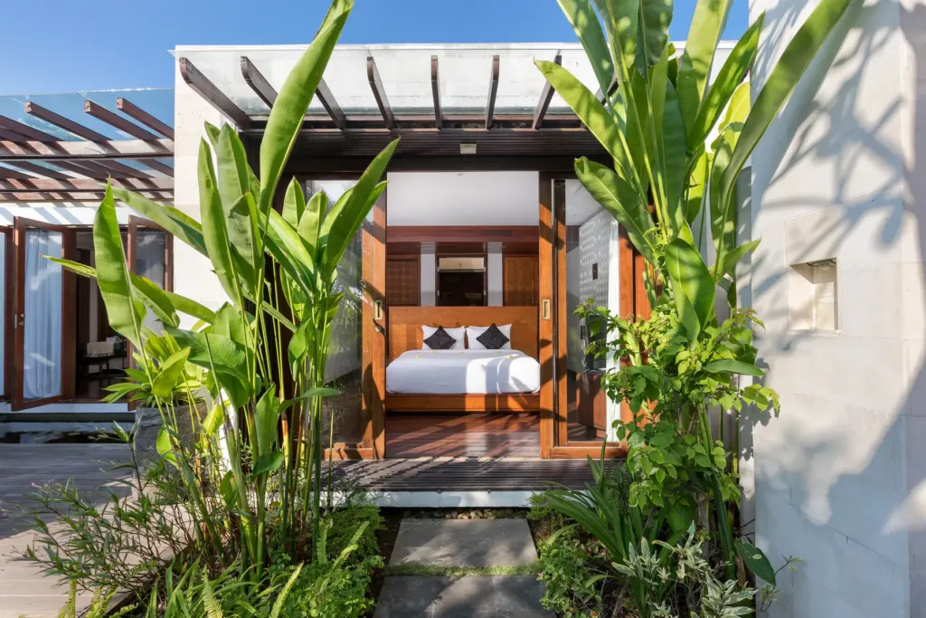 Second bedroom with king bed and garden view at villa in Batu Belig, Bali
