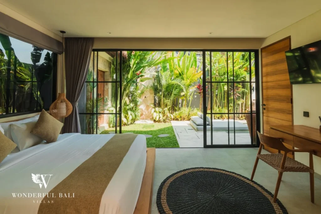 Bedroom with bed, bathtub and garden view at villa in Seseh, Bali
