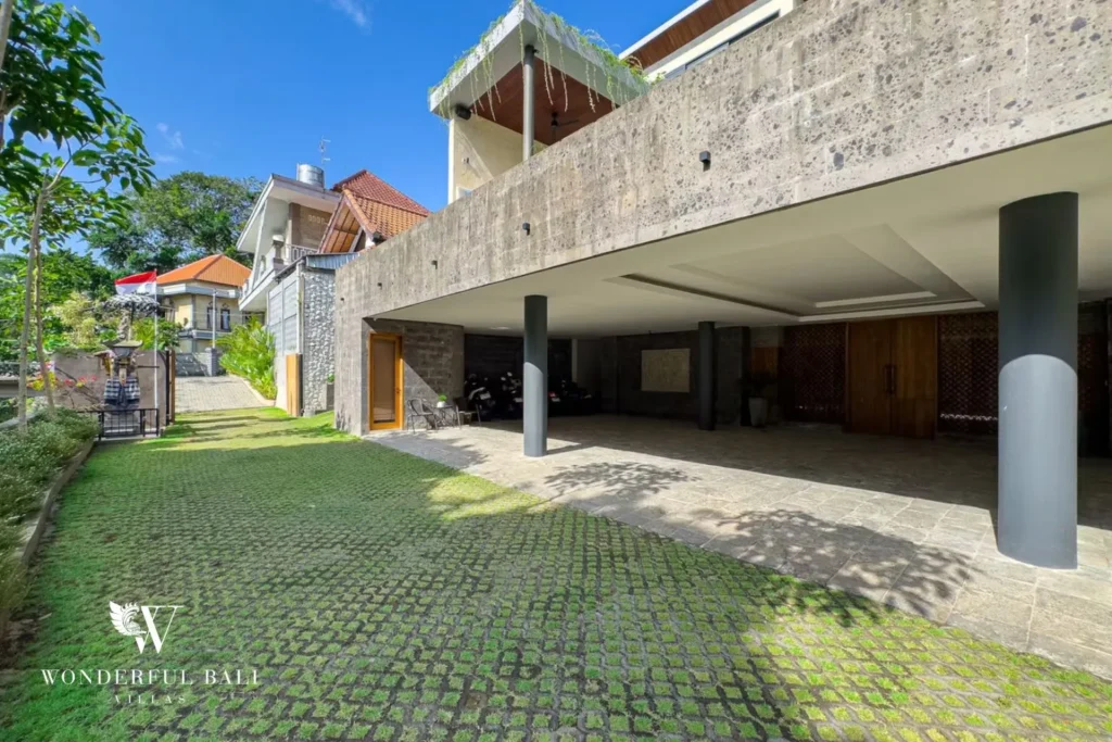 Entrance with large timber pivot doors at villa in Umalas, Bali
