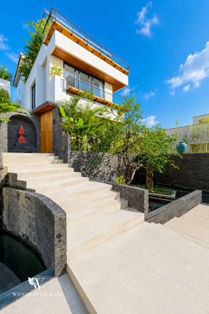 Bathroom with blue tiling and vessel basin at villa in Umalas, Bali