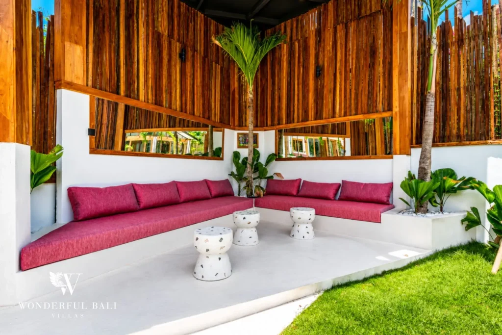 Outdoor lounge with magenta bench seating at family villa in Umalas, Bali
