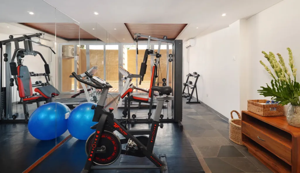 On-site gym with cardio and weight equipment in Batu Belig, Bali