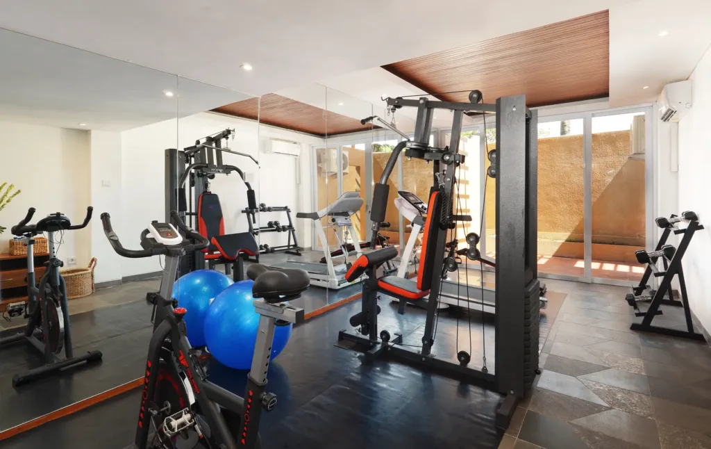On-site gym with equipment and garden view in Batu Belig, Bali