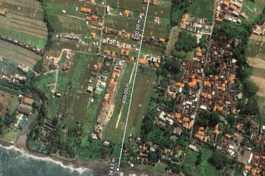 Aerial view of a land plot with location marker near the coast in Seseh Bali