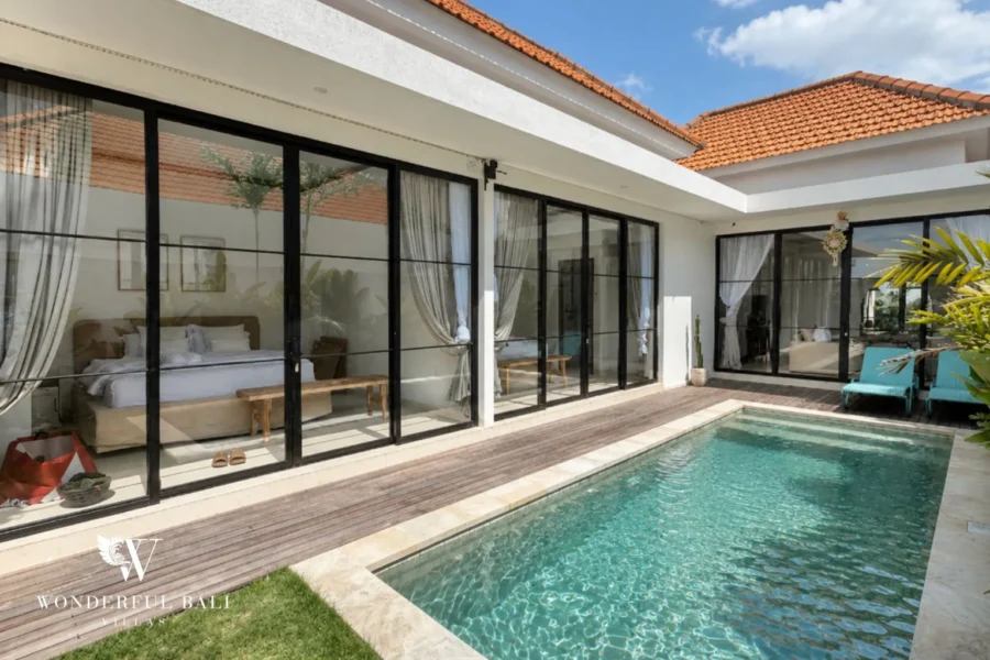 Private pool and timber sun deck outside a 2-bedroom tropical villa in Seseh Bali