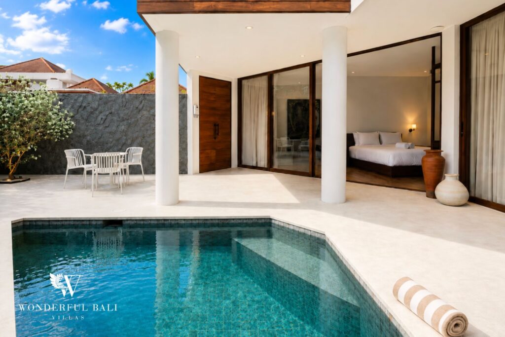 Private pool and terrace with a poolside bedroom beyond at a villa in Berawa, Canggu