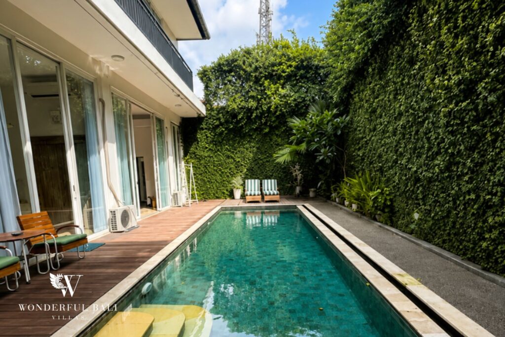 Private pool with sun loungers at a villa in Seminyak