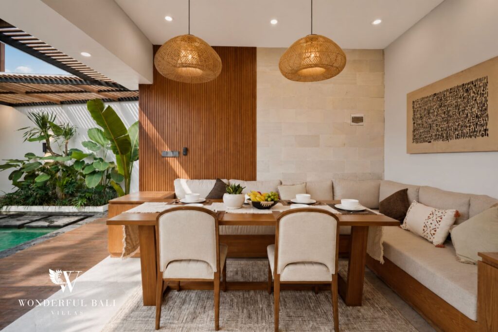 Dining area with rattan pendant lighting at a villa in Canggu