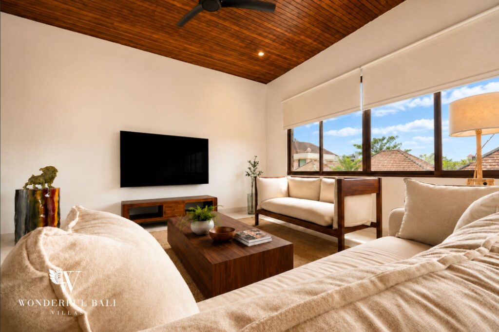 Living room with a 65-inch smart TV and sofa at a villa in Berawa, Canggu
