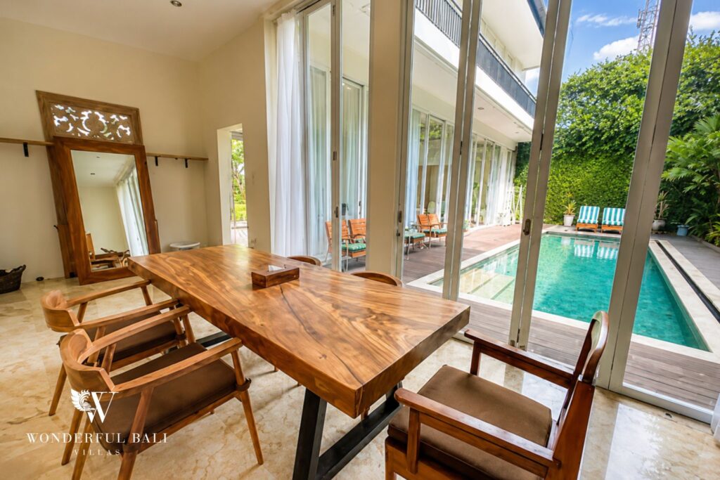 Dining area with pool view at a villa in Seminyak