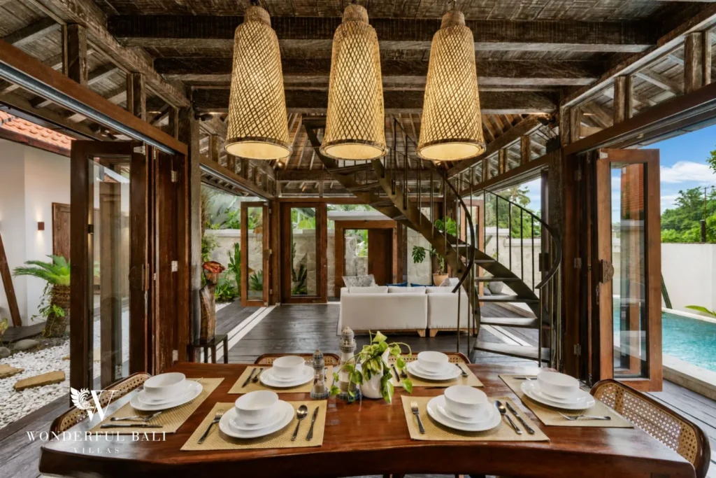 3BR tropical villa in Pererenan — living room with spiral staircase and pool view