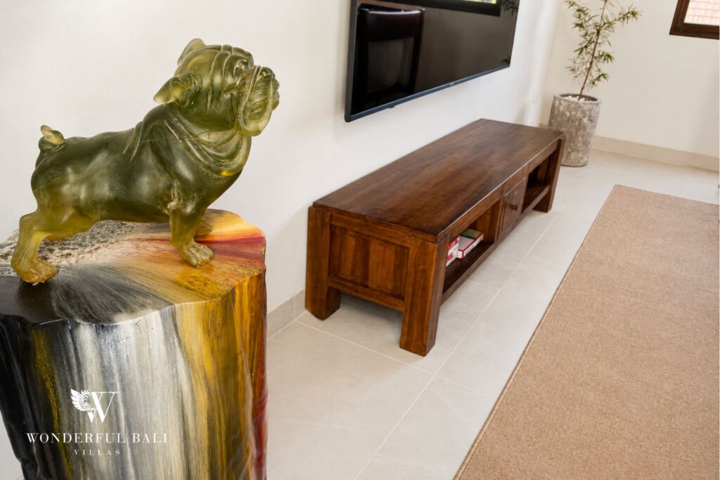 Living area with console table and framed artwork at a villa in Berawa, Canggu