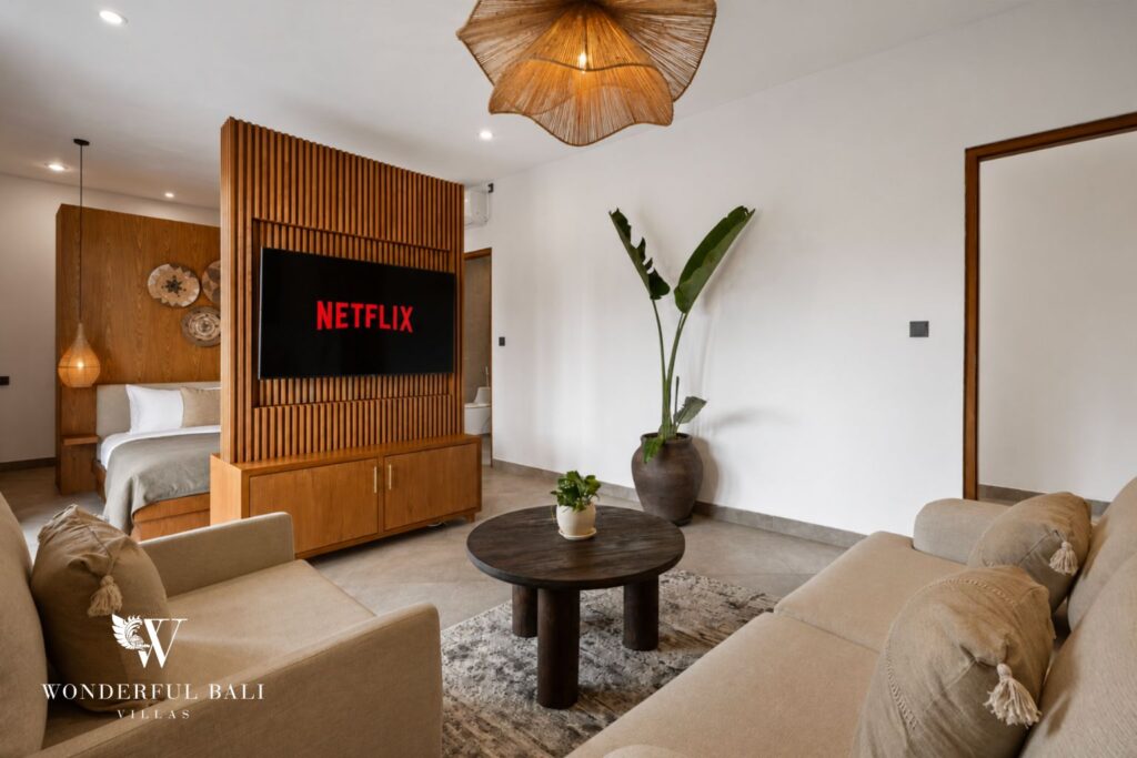 Living room with sofa and smart TV at a villa in Canggu