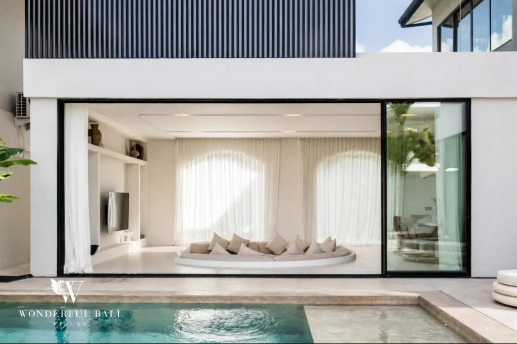 Pool terrace and open sunken lounge of a modern villa in Umalas, Bali