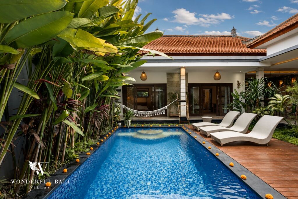 Private pool framed by a tropical garden at a villa in Batu Bolong, Canggu