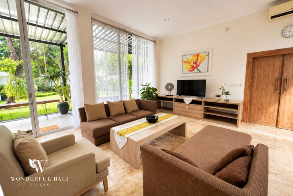 Open-plan living room with sofa at a villa in Seminyak
