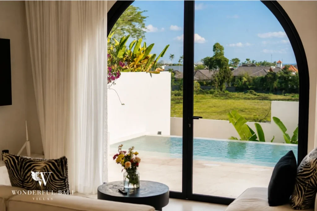 3BR ocean-view villa in Seseh — bedroom opening to rice field views