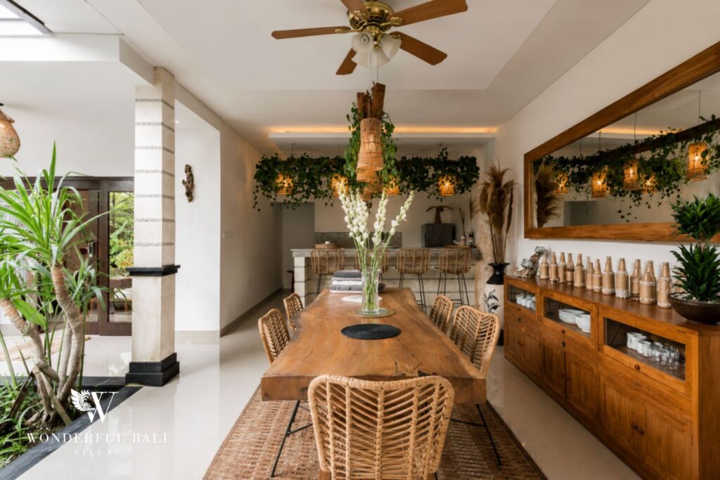 Dining area with rattan pendant lighting at a villa in Batu Bolong, Canggu