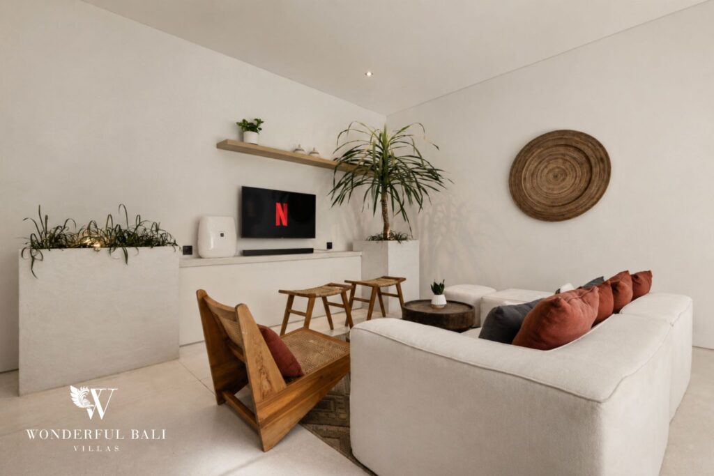 Living room with sofa and smart TV at a villa in Petitenget, Seminyak