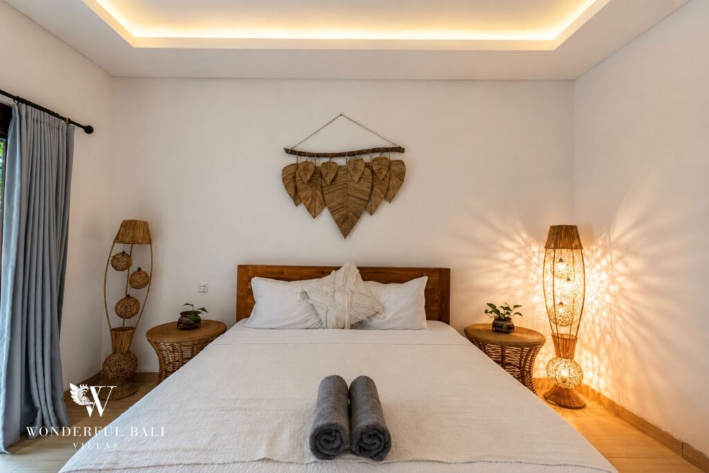 Boho en-suite bedroom with bedside lamp at a villa in Batu Bolong, Canggu