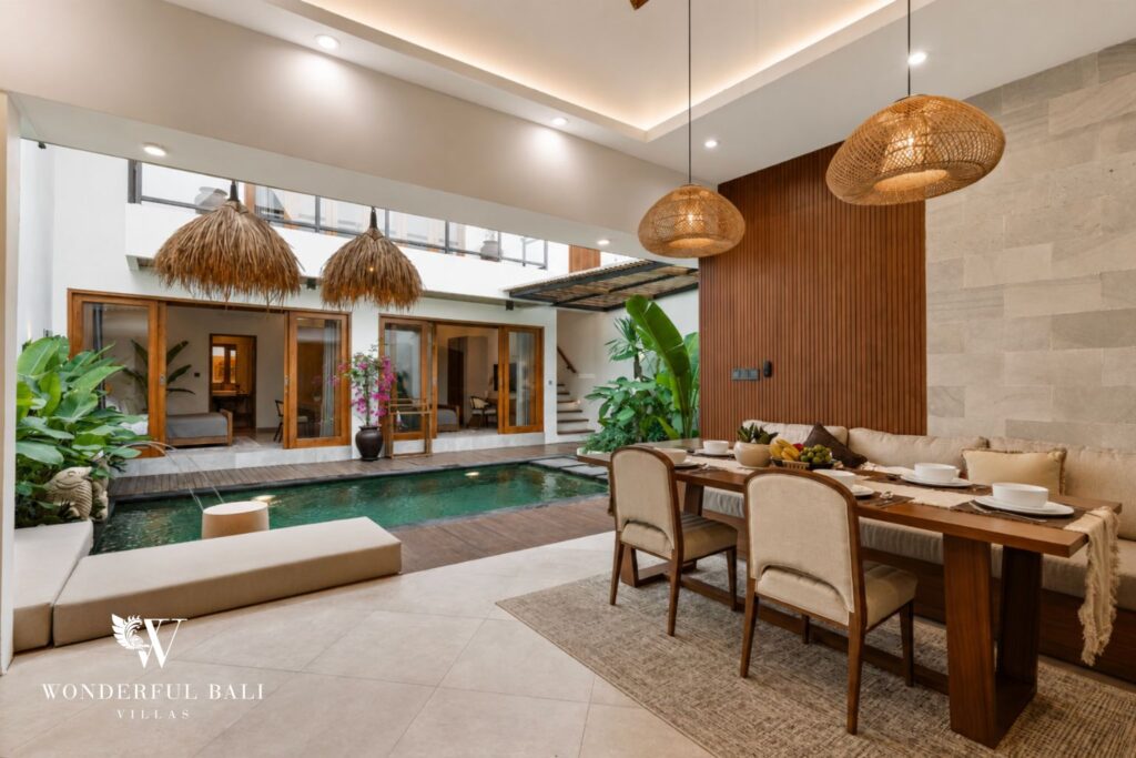 Living and dining opening to the pool at a villa in Canggu