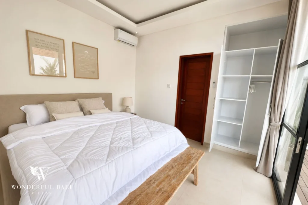 Second bedroom with built-in wardrobe and garden access in a 2-bedroom villa in Seseh Bali