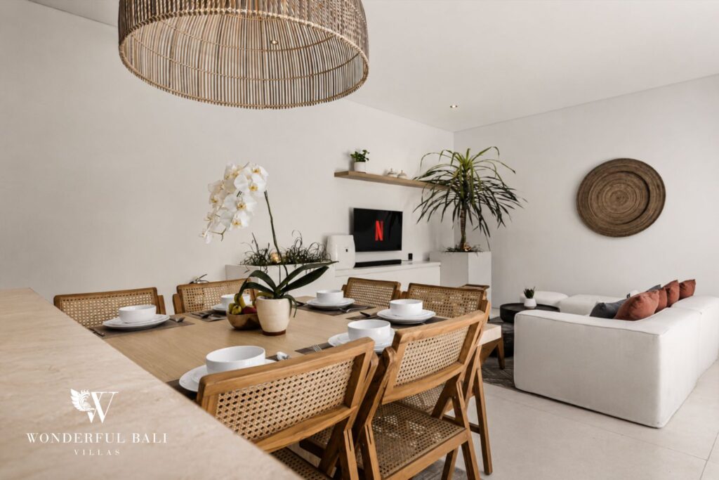 Dining area with rattan pendant lighting at a villa in Petitenget, Seminyak