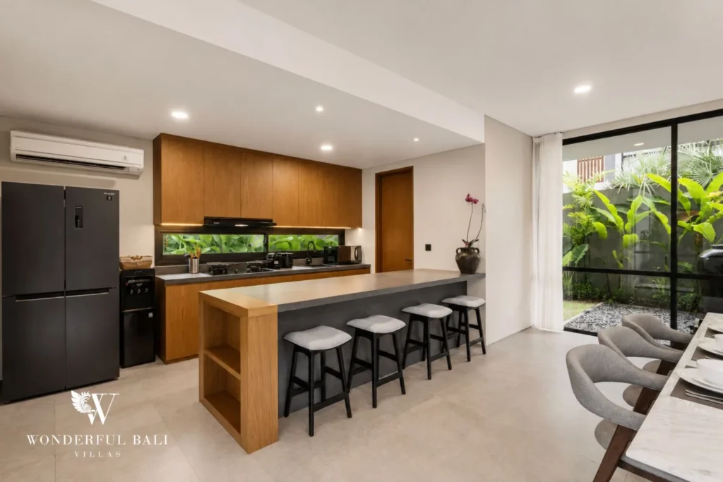 4BR resort villa in Jimbaran — kitchen and living with pool view
