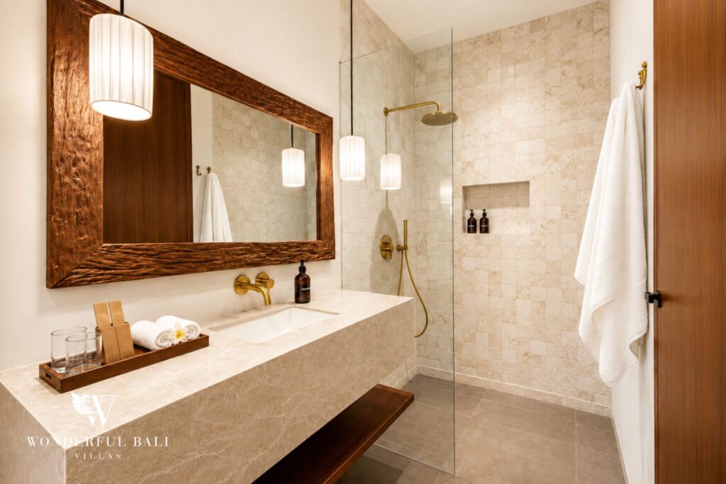 En-suite bathroom with vanity and rain shower at a villa in Berawa, Canggu