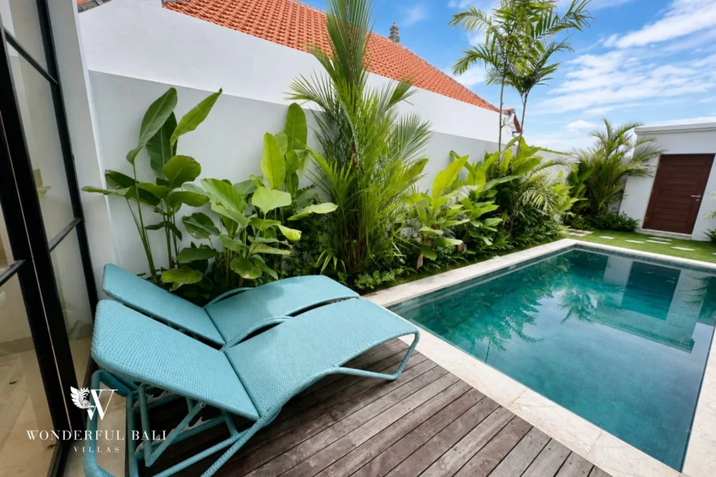 Private pool framed by heliconia and palms at a 2-bedroom villa in Seseh Bali