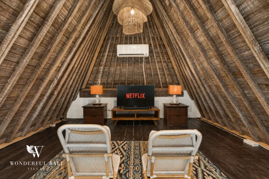 3BR tropical villa in Pererenan — dining area under soaring thatch ceiling