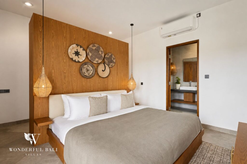 En-suite king bedroom with wardrobe at a villa in Canggu