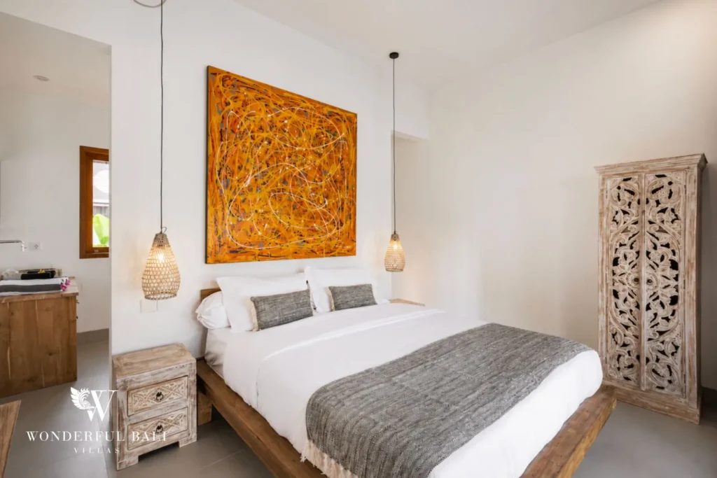 3BR tropical villa in Umalas — bedroom with batik artwork