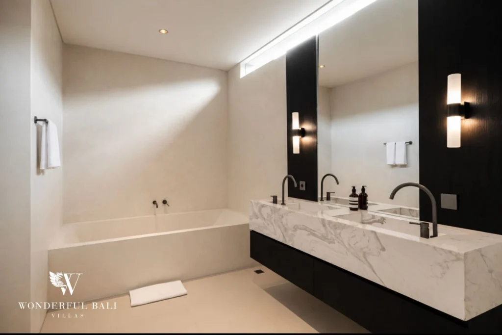 En-suite bathroom with freestanding bathtub and marble double vanity at a villa in Umalas, Bali