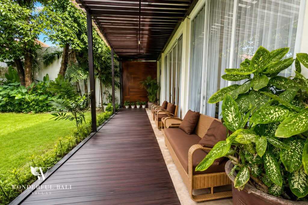 Outdoor lounge beside the garden lawn at a villa in Seminyak