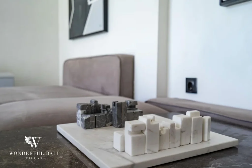Detail of marble sculptural decor pieces displayed on a coffee table in the living room at a 5-bedroom villa in Pererenan, Bali