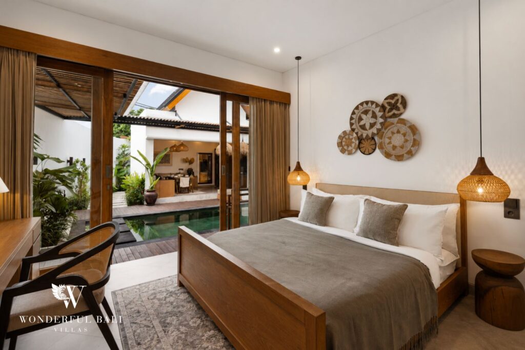 En-suite king bedroom with garden access at a villa in Canggu
