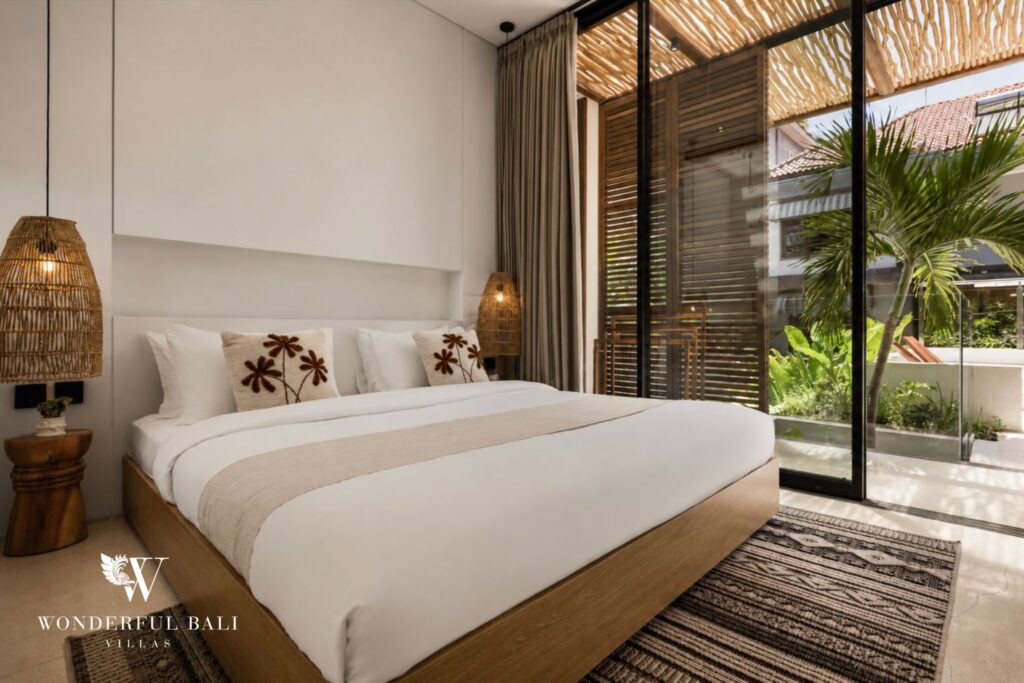 En-suite king bedroom with garden view at a villa in Petitenget, Seminyak