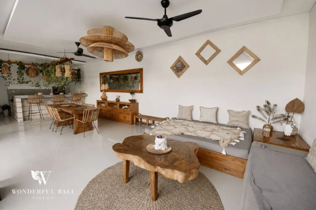 Boho living room with daybed and rattan pendant at a villa in Batu Bolong, Canggu