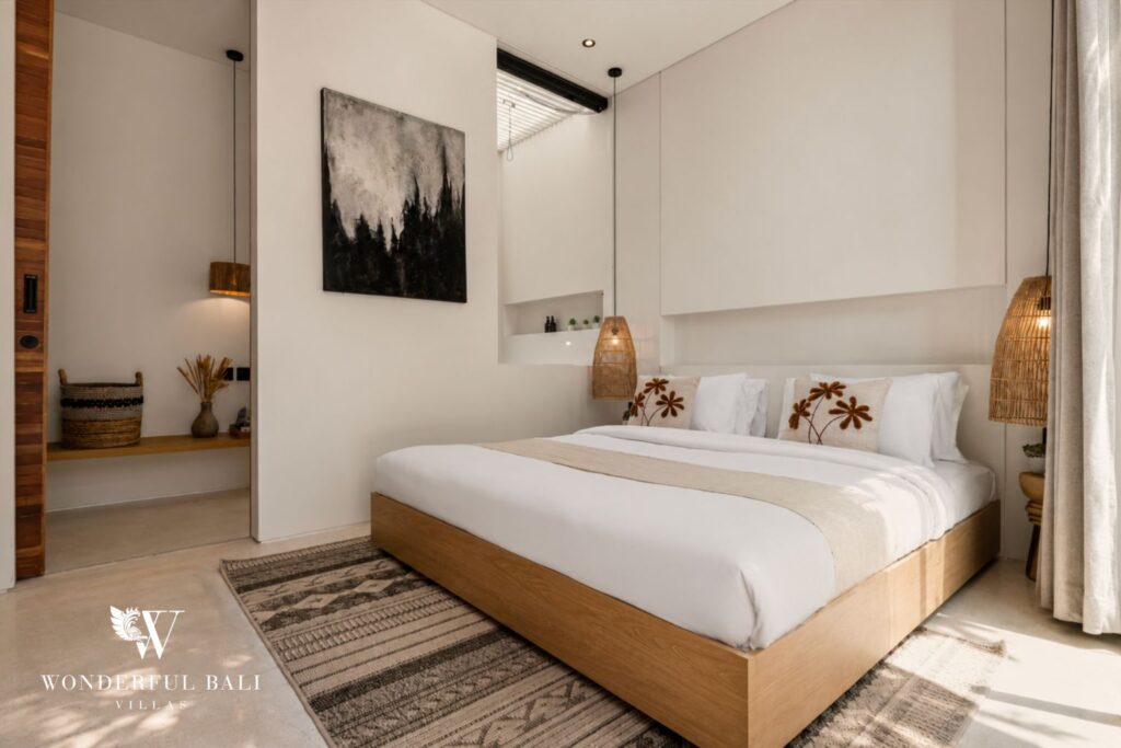 En-suite king bedroom with smart TV at a villa in Petitenget, Seminyak