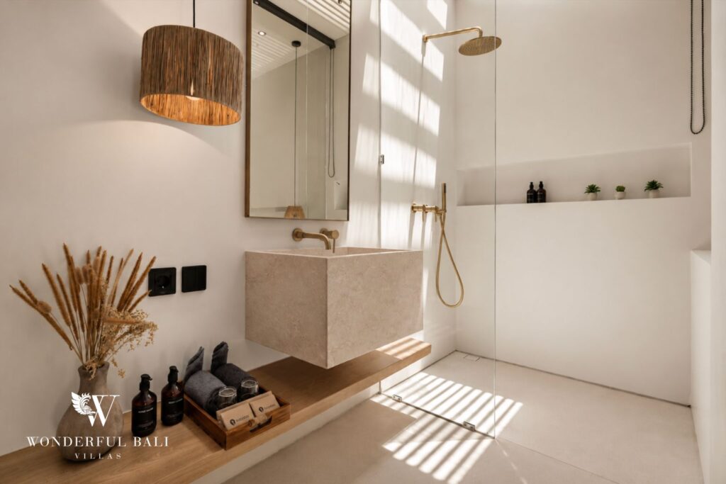 En-suite bedroom with platform bed at a villa in Petitenget, Seminyak