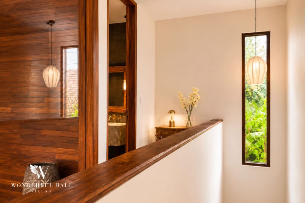 Hallway with timber storage cabinetry at a villa in Berawa, Canggu