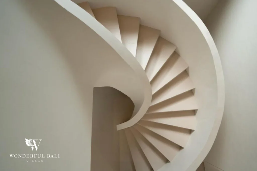 Sculptural white spiral staircase at a modern 3-bedroom villa in Umalas, Bali