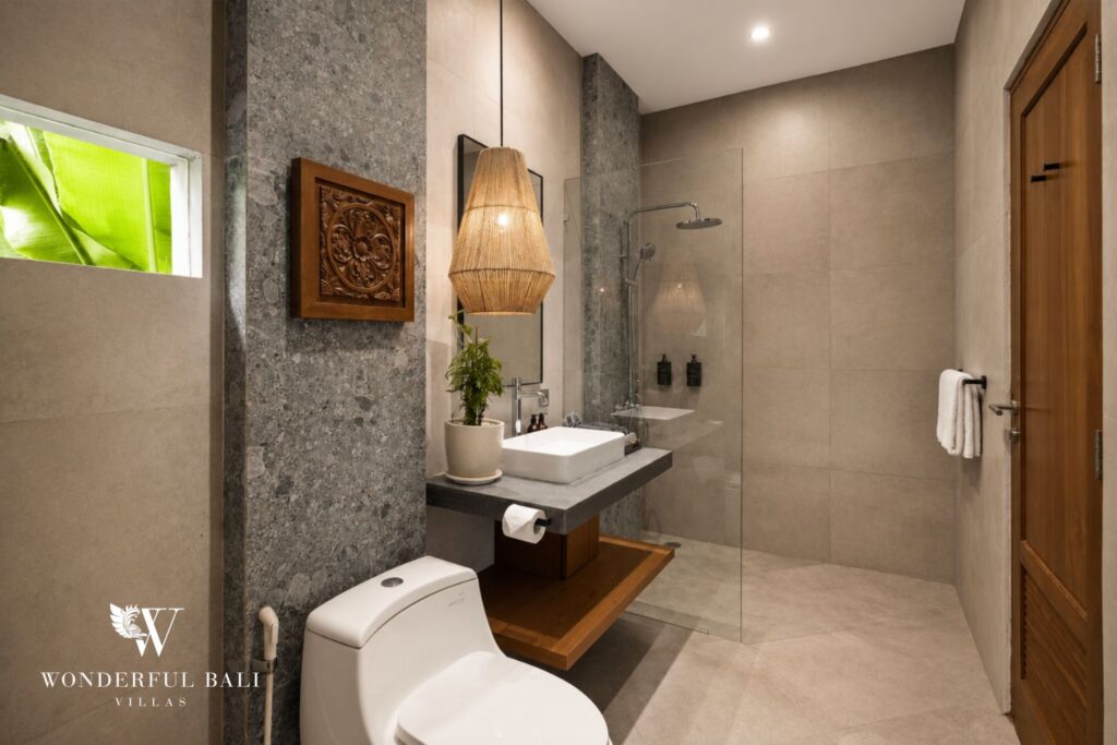 En-suite bathroom with stone vanity at a villa in Canggu