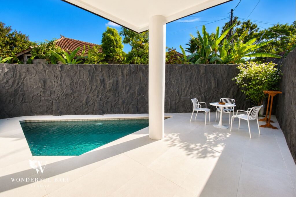 Private pool and sun terrace at a villa in Berawa, Canggu