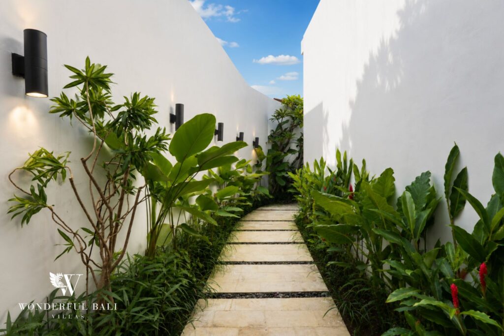 Garden with stepping-stone path and planting at a villa in Canggu